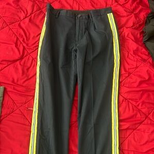 Navy blue dress pants with yellow white and blue side trim